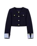 Marineblauw jasje met gouden knopen
